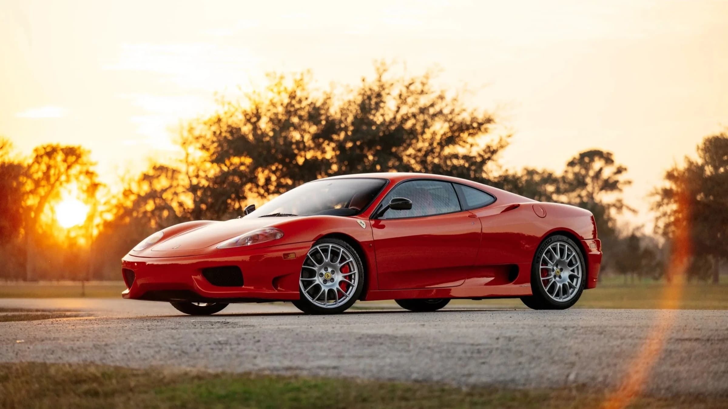 2004 Ferrari Challenge Stradale in Rosso Corsa, photographed at golden hour